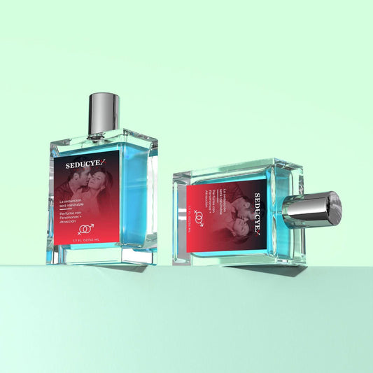 Two perfume bottles with red labels on a light green background
