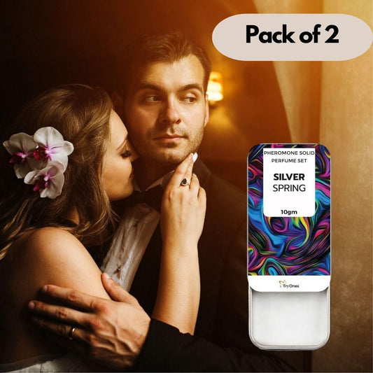 Packaging of Silver Spring Pheromone Solid Perfume Set with a couple embracing in the background.