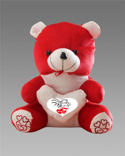 Red teddy bear with a white heart and red hearts on paws against a gray background