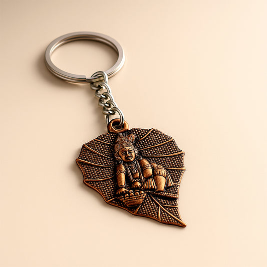 Premium Antique-Finish Metal Keychain with BalKrishna on Peepal Leaf – Elegant Religious Keyring for Car, Bike, Home & Gift (1 Pc)